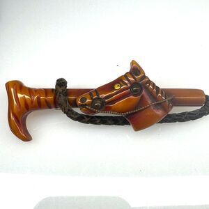 Red Butterscotch Bakelite Carved Horse Crop Brooch Pin Derby Art Deco Metal Eye